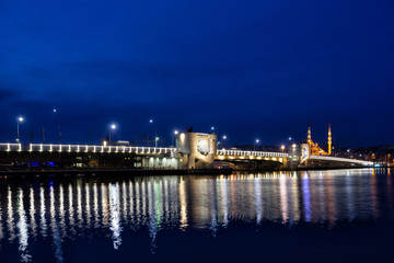 Fototapeta na wymiar Galata Bridge lit by lights at night