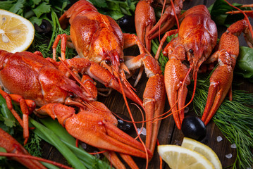Crayfish. Red boiled crawfishes on table in rustic style, closeup. Lobster closeup.