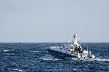 Fototapeta na wymiar FAST MOTOR BOAT - Border Guard boat patrol