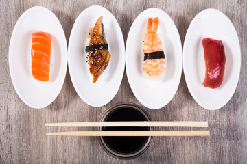 four kinds of Nigirisushi on oval saucers