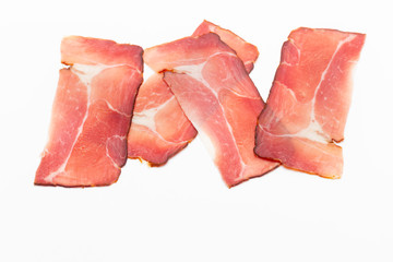 Hamon sliced on white background. Spanisch traditional meat.