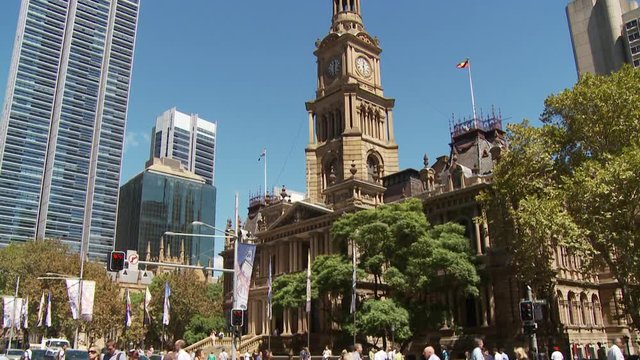 WS TU Pedestrians crossing street intersection near Town Hall / Sydney, New South Wales, Australia