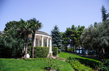 Antique-style gazebo in an olive grove near the pond, Crimea