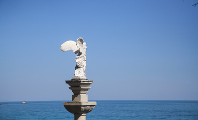 Statue of Winged Victory of Samothrace (called Nike of Samothrace) in the Park Aivazovsky in Crimea 