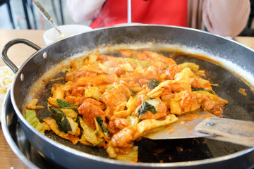 Korean food consists of chicken, vegetables and chili paste.#2