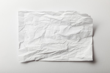 top view of blank crumpled page on white background