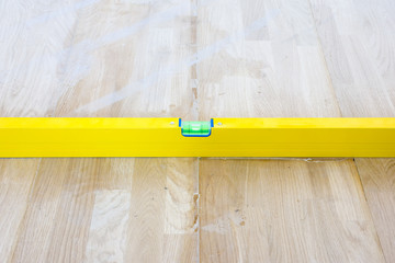Check liquid vial indicator or horizontal marker evenness laid parquet floor. The completion of the...