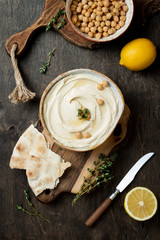 Homemade hummus with thyme, olive oil. Middle Eastern traditional and authentic arab cuisine. Top...