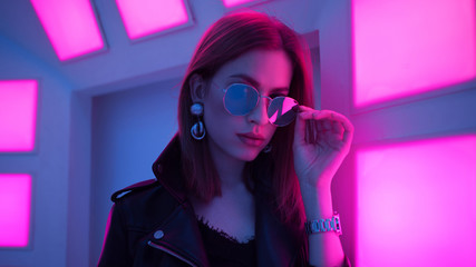 Futuristic style portrait in blue and purple light.