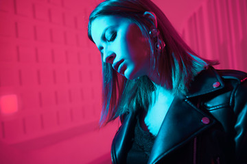Beautiful girl in retro wave on the neon light