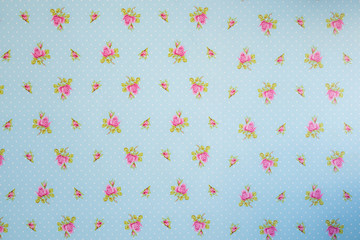 drawing of pink flowers on blue background with white dots