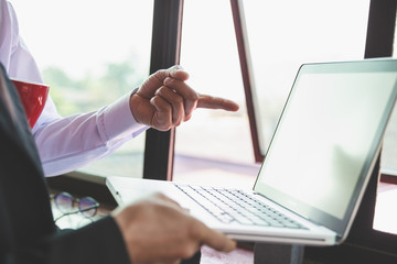 Team business meeting presentation. Hand businessman working project in modern office.Laptop computer  in morning light