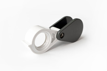 Magnifying glass for diamonds or see the amulet Isolated on a White Background.
