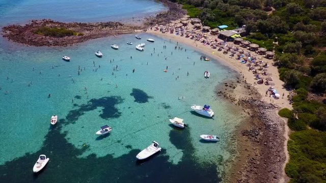 Aerial view video from famous organised beach in small island of Monolia part of archipelago paradise exotic islands of Lihadonisia with clear turquoise sea beaches, North Evoia island, Greece