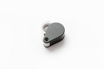Magnifying glass for diamonds or see the amulet Isolated on a White Background.