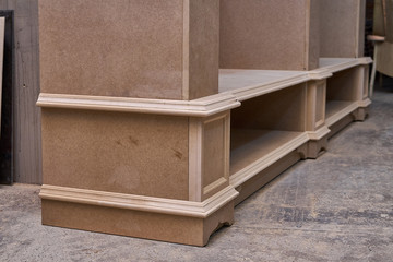 Mdf cabinet carcass. Home library with classic design. Wooden furniture manufacturing process