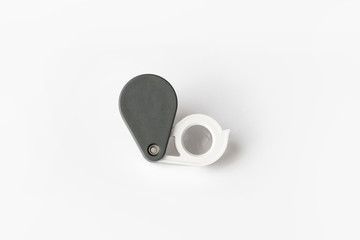 Magnifying glass for diamonds or see the amulet Isolated on a White Background.