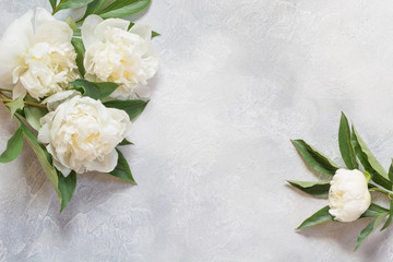 Bouquet of white peony flowers on vintage table. Copy space.