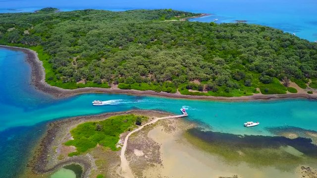 Aerial view video from famous organised beach in small island of Monolia part of archipelago paradise exotic islands of Lihadonisia with clear turquoise sea beaches, North Evoia island, Greece