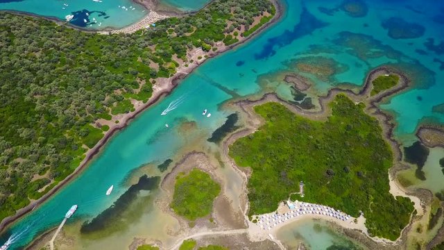 Aerial view video from famous organised beach in small island of Monolia part of archipelago paradise exotic islands of Lihadonisia with clear turquoise sea beaches, North Evoia island, Greece