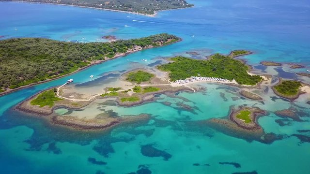 Aerial view video from famous organised beach in small island of Monolia part of archipelago paradise exotic islands of Lihadonisia with clear turquoise sea beaches, North Evoia island, Greece