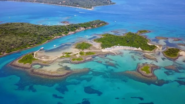 Aerial view video from famous organised beach in small island of Monolia part of archipelago paradise exotic islands of Lihadonisia with clear turquoise sea beaches, North Evoia island, Greece