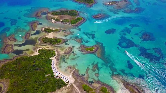 Aerial view video from famous organised beach in small island of Monolia part of archipelago paradise exotic islands of Lihadonisia with clear turquoise sea beaches, North Evoia island, Greece
