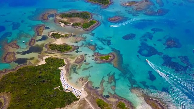 Aerial view video from famous organised beach in small island of Monolia part of archipelago paradise exotic islands of Lihadonisia with clear turquoise sea beaches, North Evoia island, Greece