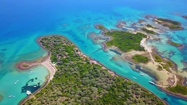 Aerial view video from famous organised beach in small island of Monolia part of archipelago paradise exotic islands of Lihadonisia with clear turquoise sea beaches, North Evoia island, Greece