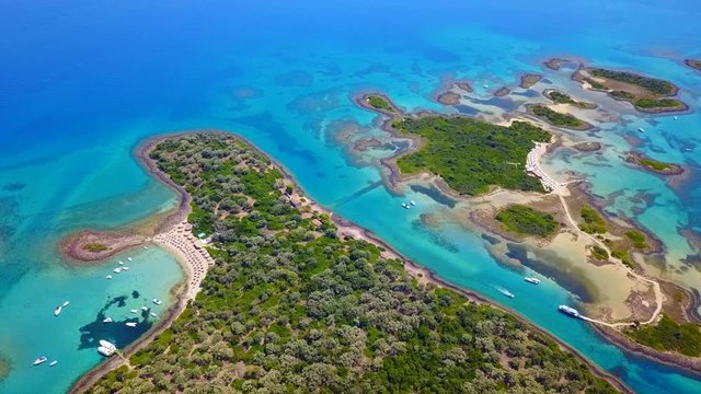 Aerial view video from famous organised beach in small island of Monolia part of archipelago paradise exotic islands of Lihadonisia with clear turquoise sea beaches, North Evoia island, Greece
