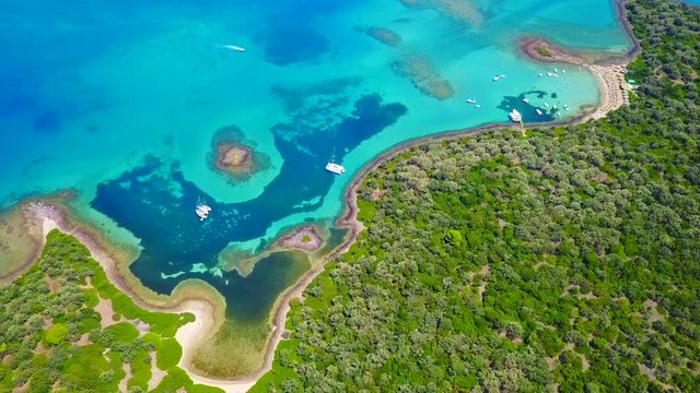 Aerial view video from famous organised beach in small island of Monolia part of archipelago paradise exotic islands of Lihadonisia with clear turquoise sea beaches, North Evoia island, Greece