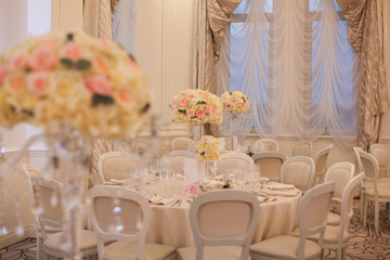 Elegant wedding reception table arrangement, floral centerpiece