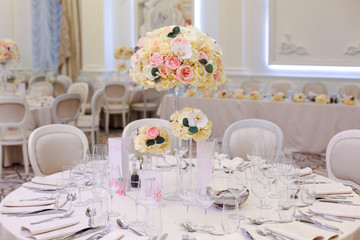 Elegant wedding reception table arrangement, floral centerpiece