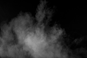 Bizarre forms of white powder explosion cloud against black background.White dust particles splash.