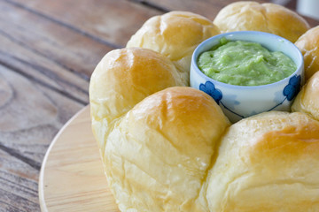Homemade bread served with Thai pandan custard.