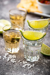 Shots of silver and gold tequila