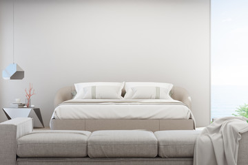 Sea view living room and bedroom of luxury summer beach house with sofa near double bed. Empty white concrete wall background in vacation home or holiday villa. Hotel interior 3d illustration.