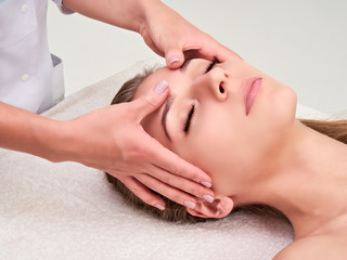 Obraz na płótnie Canvas Leisure. Woman in spa salon. Massage and face care. Spa face massage woman hands treatment.