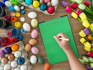 easter, holidays, tradition and object concept on wooden