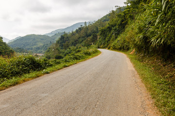 Fototapeta na wymiar asphalt road in the mountains, Oudomxay Province Laos