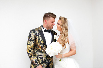 Beautiful wedding couple posing outdoor