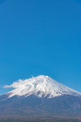 Close-up snow covered Mount Fuji ( Mt. Fuji ) in clear blue sky background on winter season. Fujiyoshida City, Yamanashi Prefecture, Japan