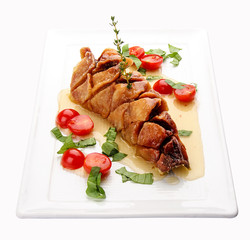 Fried pike perch with sauce and cherry tomatoes. On white background.