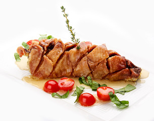 Fried pike perch with sauce and cherry tomatoes. On white background.