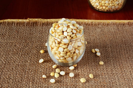 traditional indian roadside street snack food roasted chickpea nut daliya dalia or chana dal  isolated on jute  background