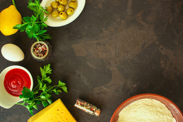 set ingredients are dough and filling, sauce (flour, olives, greens, and more). food background....