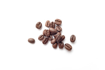 Roasted coffee beans isolated on white background. Close-up.