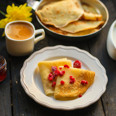 pancakes crepes fritters with raspberry berries (pancakes with filling) Shrovetide. food background. top view