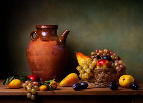 Still life with apple, grapes, pears and plums