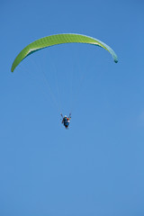 Lone Paraglider seen over the skies of Bali Indonesia